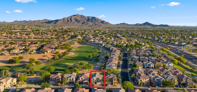 aerial perspective of suburban area featuring a mountainous background and a local golf course