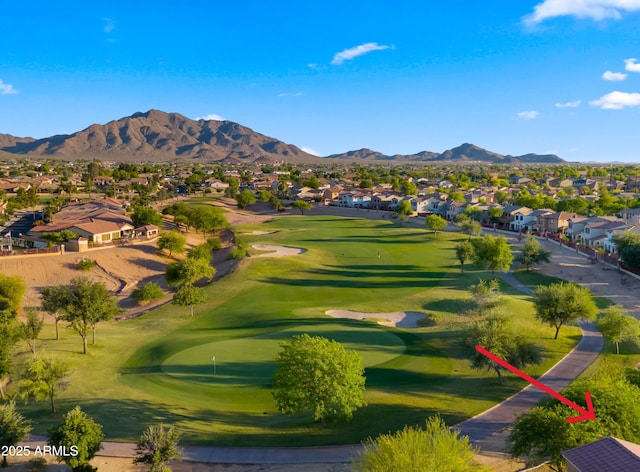 view of community with a residential view, a mountain view, and golf course view