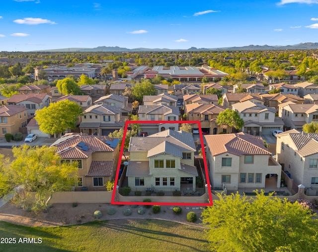 aerial perspective of suburban area featuring property boundaries highlighted and mountains