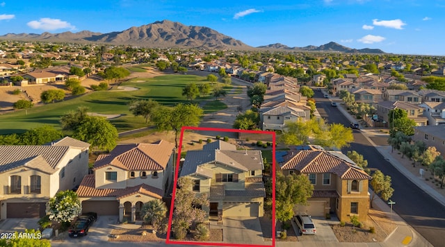 aerial perspective of suburban area featuring mountains, a local golf course, and property parcel outlined