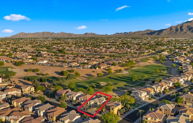 aerial view of property and surrounding area with nearby suburban area, a mountain backdrop, property boundaries highlighted, and a golf course