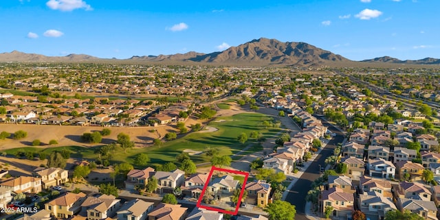 view of property location with nearby suburban area, a mountainous background, property boundaries highlighted, and a golf course