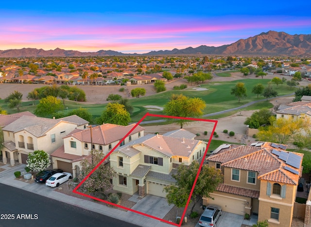 aerial view at dusk of a residential view, a mountain view, property parcel outlined, and golf course view