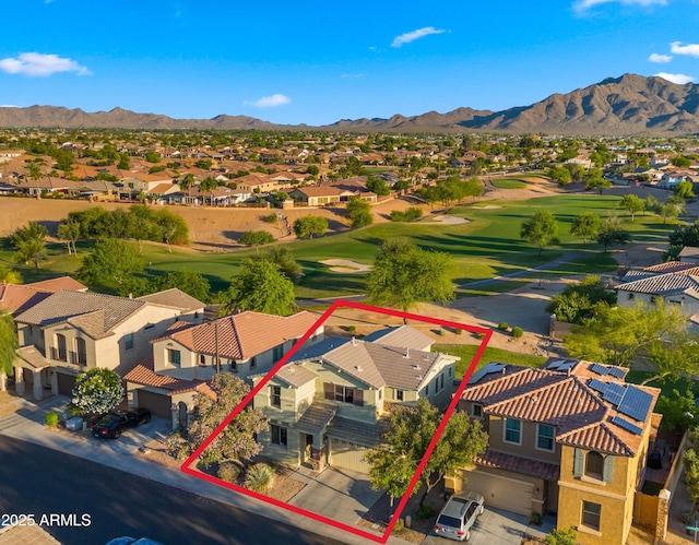 aerial view of residential area featuring property boundaries highlighted, a golf club, and a mountain backdrop