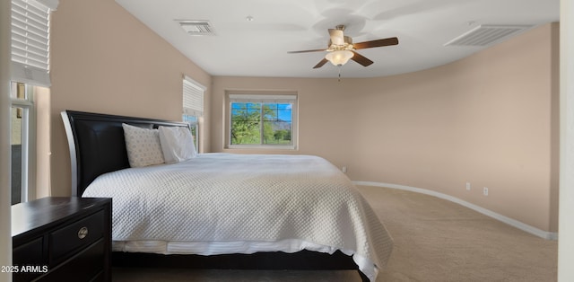 bedroom with carpet floors, baseboards, and a ceiling fan