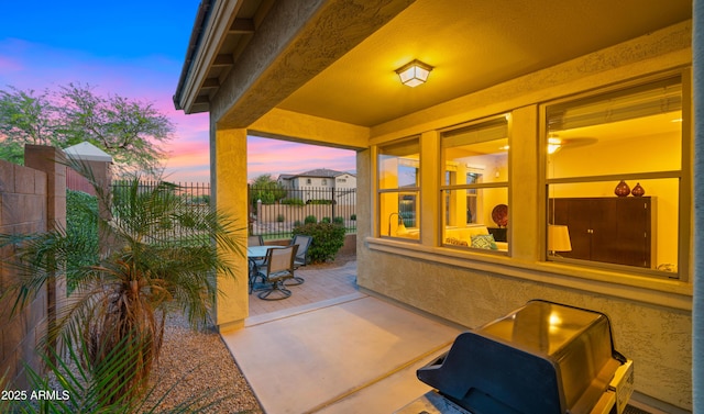 patio terrace at dusk with fence