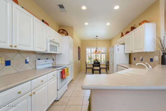 19607 N Flint Way, Surprise, AZ 85374 - kitchen featuring white appliances, a sink, recessed lighting, light countertops, and white cabinets