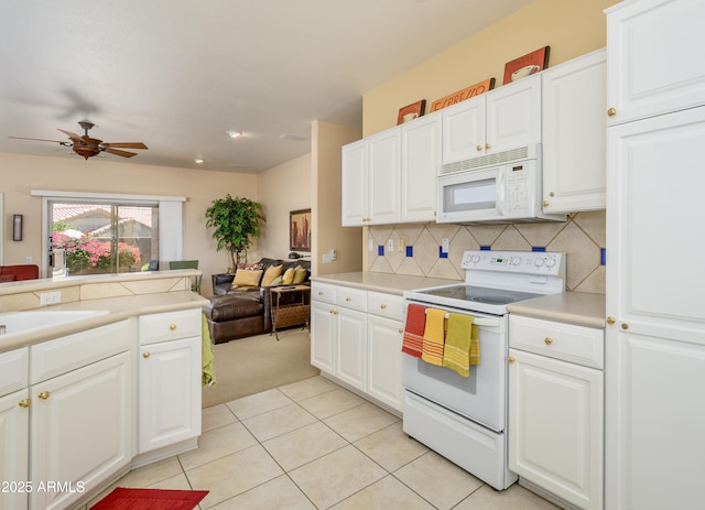 19607 N Flint Way, Surprise, AZ 85374 - kitchen featuring white appliances, open floor plan, light countertops, decorative backsplash, and a ceiling fan