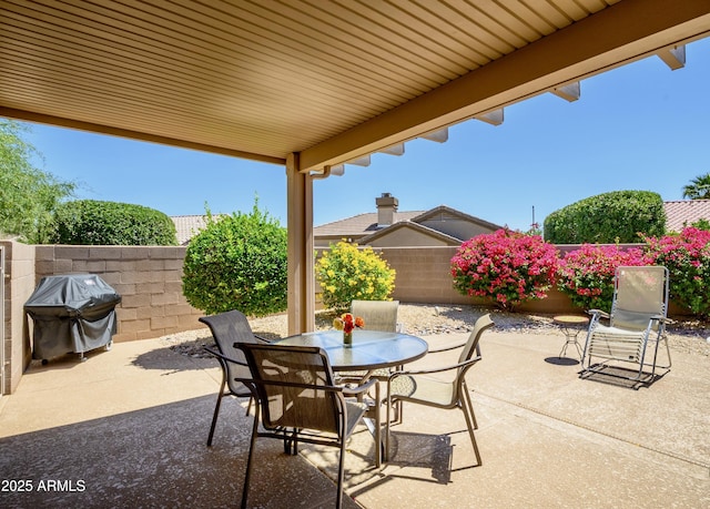 19607 N Flint Way, Surprise, AZ 85374 - fenced backyard with a patio, outdoor dining space, and area for grilling