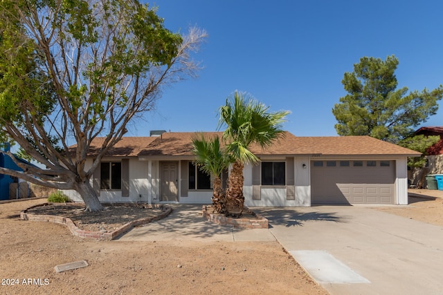 ranch-style home with a garage