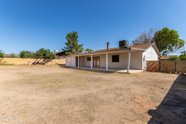 rear view of property with a patio and cooling unit