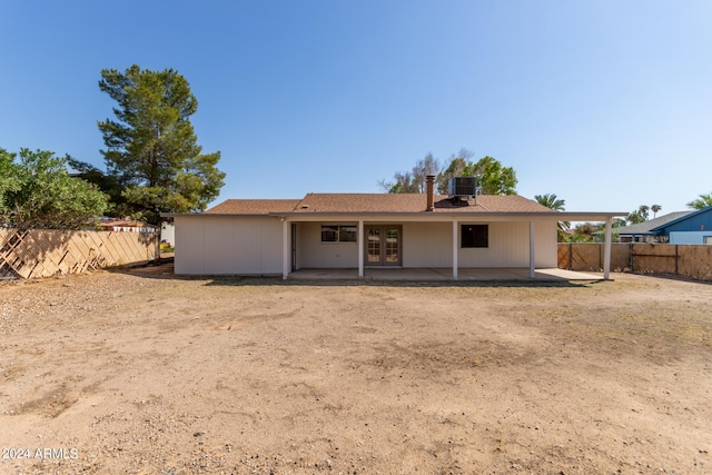 back of house with cooling unit and a patio