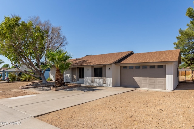 single story home with a garage