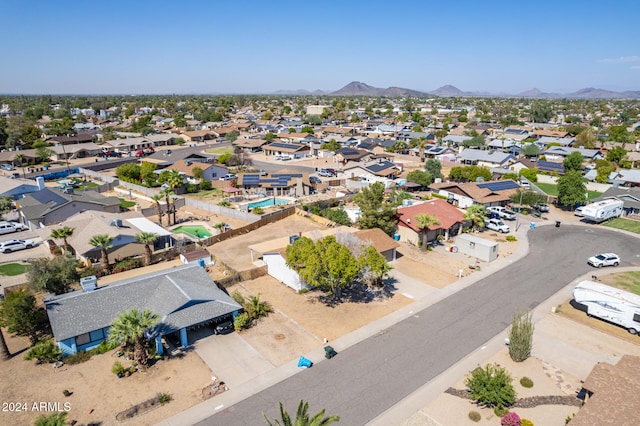 birds eye view of property with a mountain view