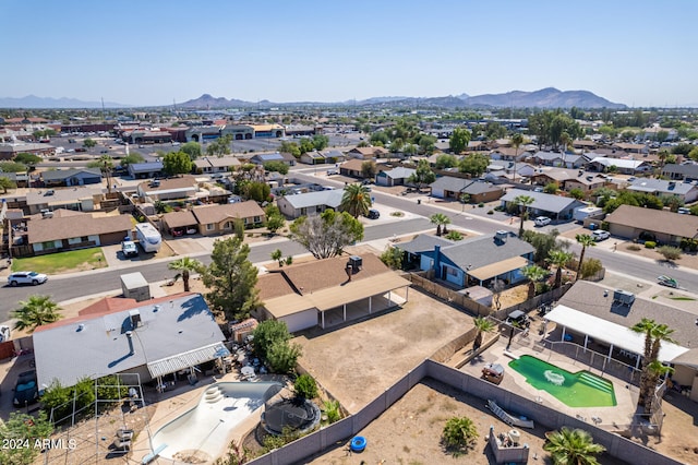 birds eye view of property featuring a mountain view