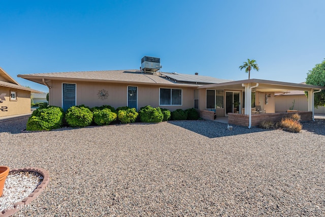 ranch-style house with a patio area and central air condition unit