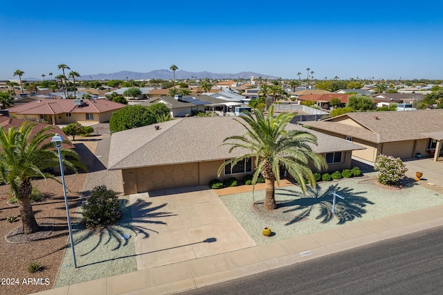 birds eye view of property featuring a mountain view