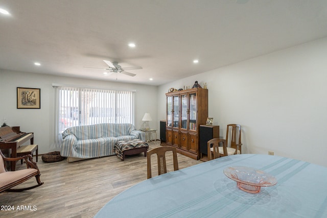 dining room with ceiling fan and light hardwood / wood-style floors