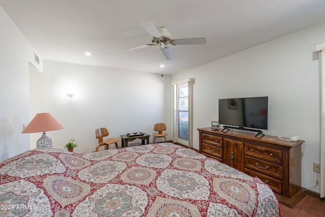 bedroom featuring ceiling fan and light colored carpet