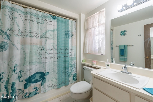 full bathroom with vanity, shower / tub combo, toilet, and tile patterned floors