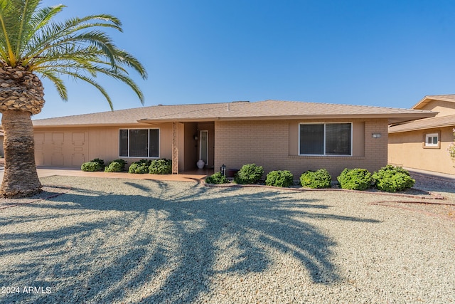 single story home featuring a garage