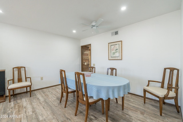 dining room with light wood-type flooring and ceiling fan