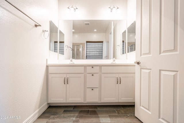 bathroom with vanity and an enclosed shower