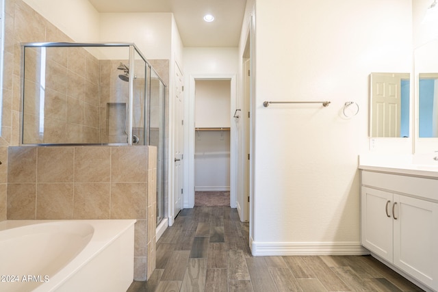 bathroom featuring vanity and plus walk in shower