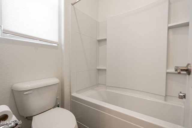 bathroom featuring toilet and shower / washtub combination