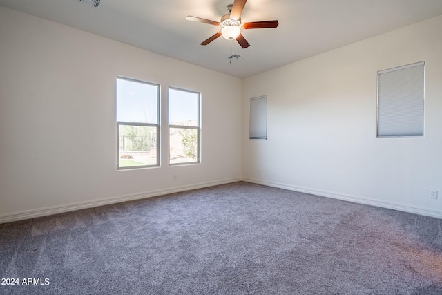 unfurnished room featuring ceiling fan and carpet floors