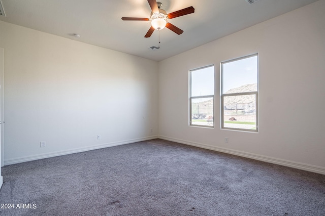 carpeted empty room with ceiling fan