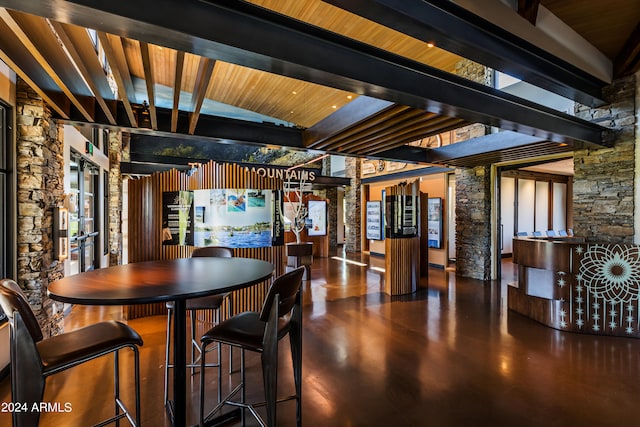 dining area with vaulted ceiling with beams and wooden ceiling