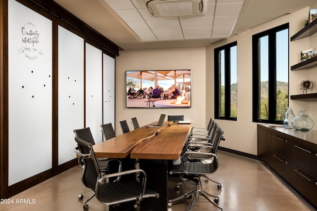 dining area with a drop ceiling