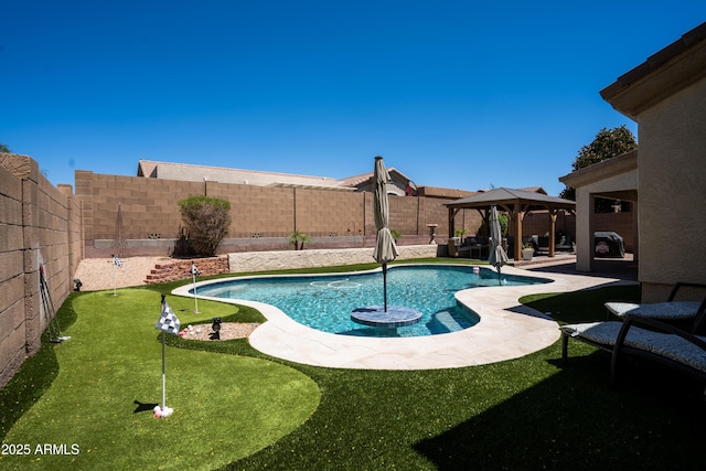 view of pool with a fenced backyard, a fenced in pool, a patio, and a gazebo