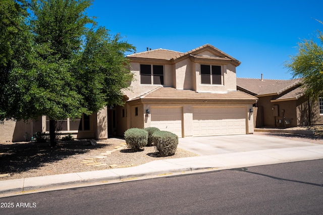 traditional-style house with a garage, stucco siding, a tiled roof, and concrete driveway
