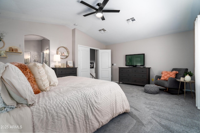 carpeted bedroom with visible vents, arched walkways, ceiling fan, and lofted ceiling