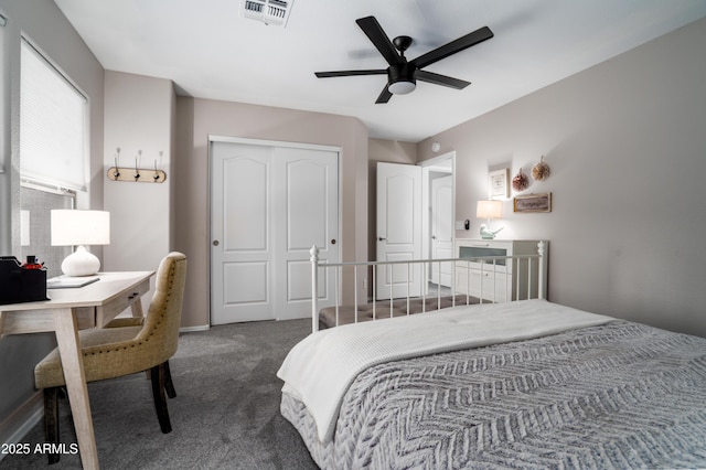 carpeted bedroom with ceiling fan, a closet, and visible vents