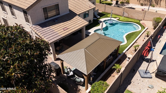 view of swimming pool featuring a fenced in pool, a fenced backyard, and a patio