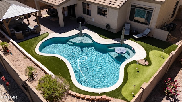 view of swimming pool with a patio, outdoor lounge area, a fenced in pool, and a gazebo