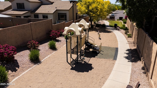 view of yard featuring fence and playground community