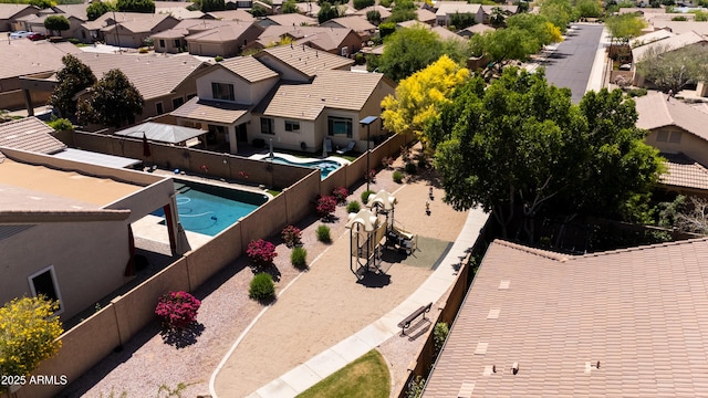 view of pool with a residential view, a fenced in pool, and a fenced backyard