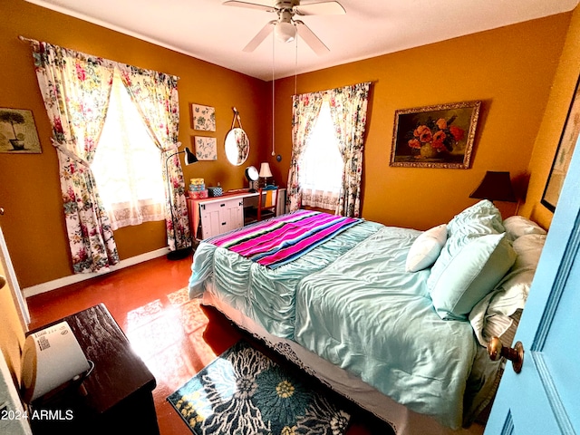 bedroom with multiple windows and ceiling fan