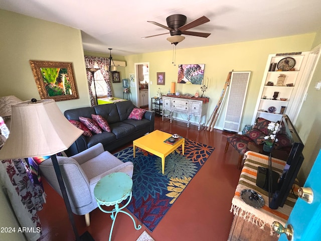 living room featuring ceiling fan and a wall unit AC