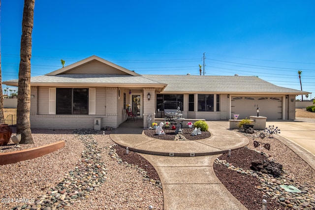 ranch-style house featuring a garage