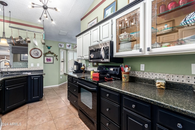 kitchen with sink, a textured ceiling, white cabinets, black electric range oven, and hanging light fixtures