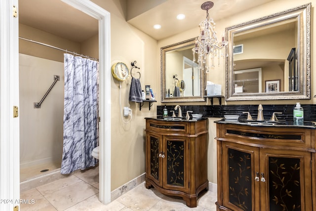 bathroom featuring decorative backsplash, tile patterned flooring, double vanity, toilet, and walk in shower