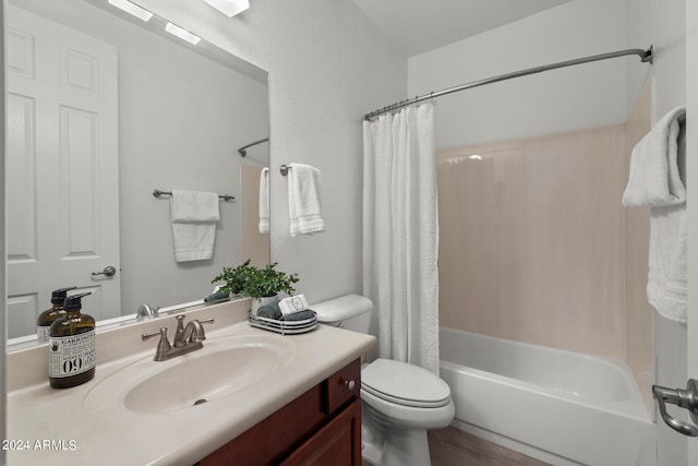 full bathroom featuring shower / bathtub combination with curtain, hardwood / wood-style flooring, vanity, and toilet