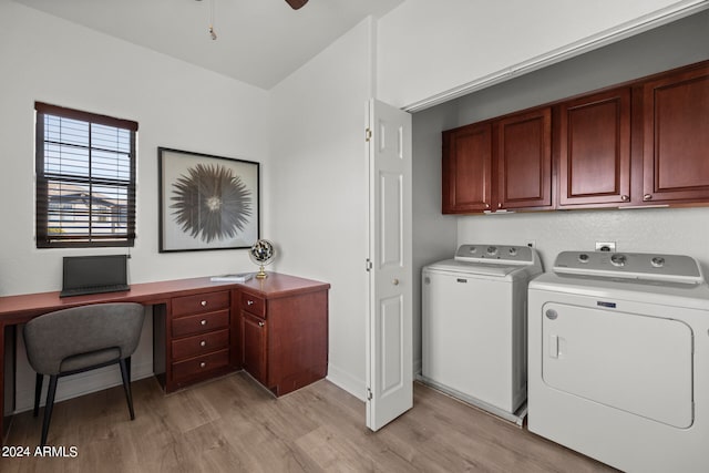 washroom with light wood-type flooring, ceiling fan, washing machine and clothes dryer, and cabinets