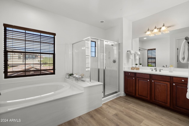 bathroom featuring vanity, shower with separate bathtub, and wood-type flooring