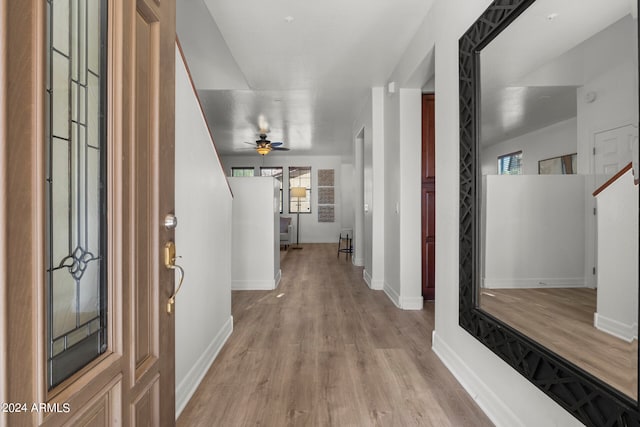 hallway with light wood-type flooring